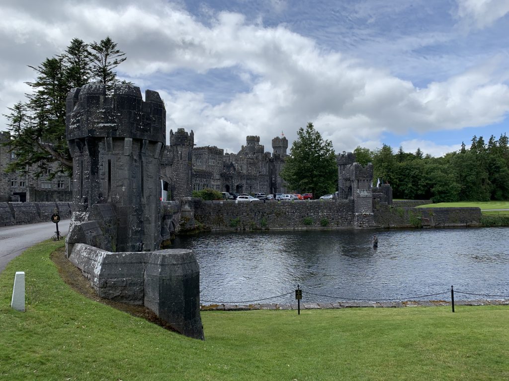 Ashford Castle in Cong, Ireland, viewed across the lawn.