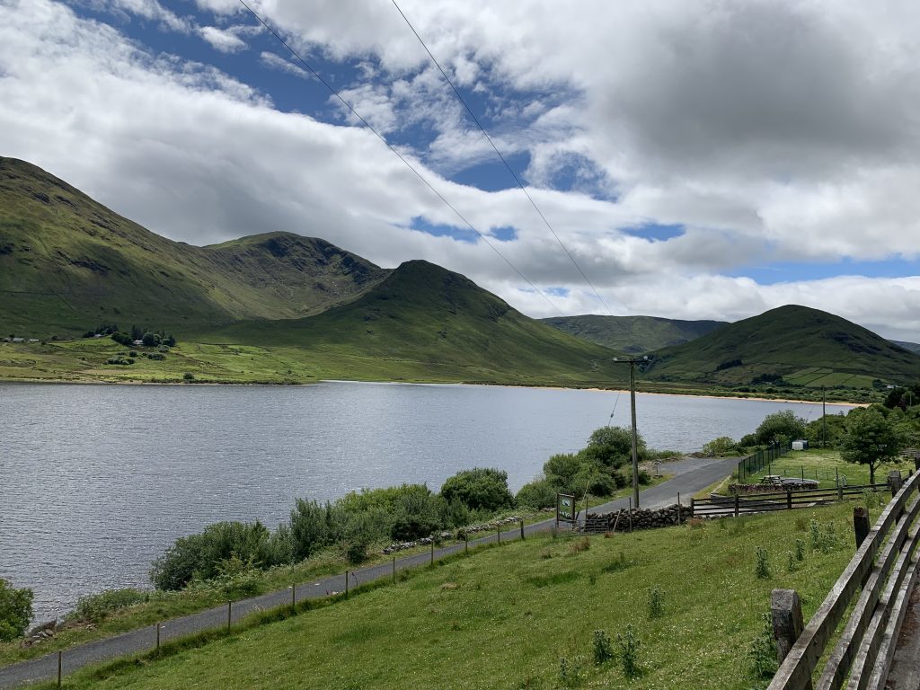 Rugged Connemara mountains reflected in a lake in western Ireland.